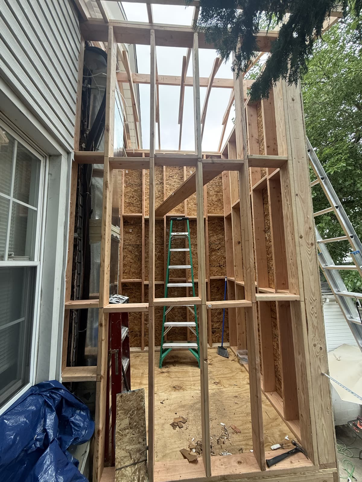 New residential framing tied into an existing home by ARCED