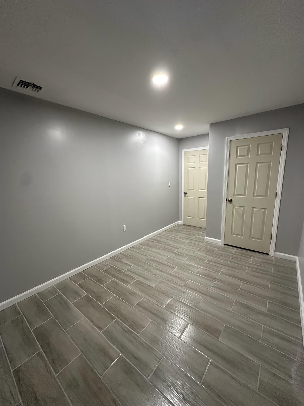 Two-bedroom basement apartment — real ARCED project photo 11 of 19