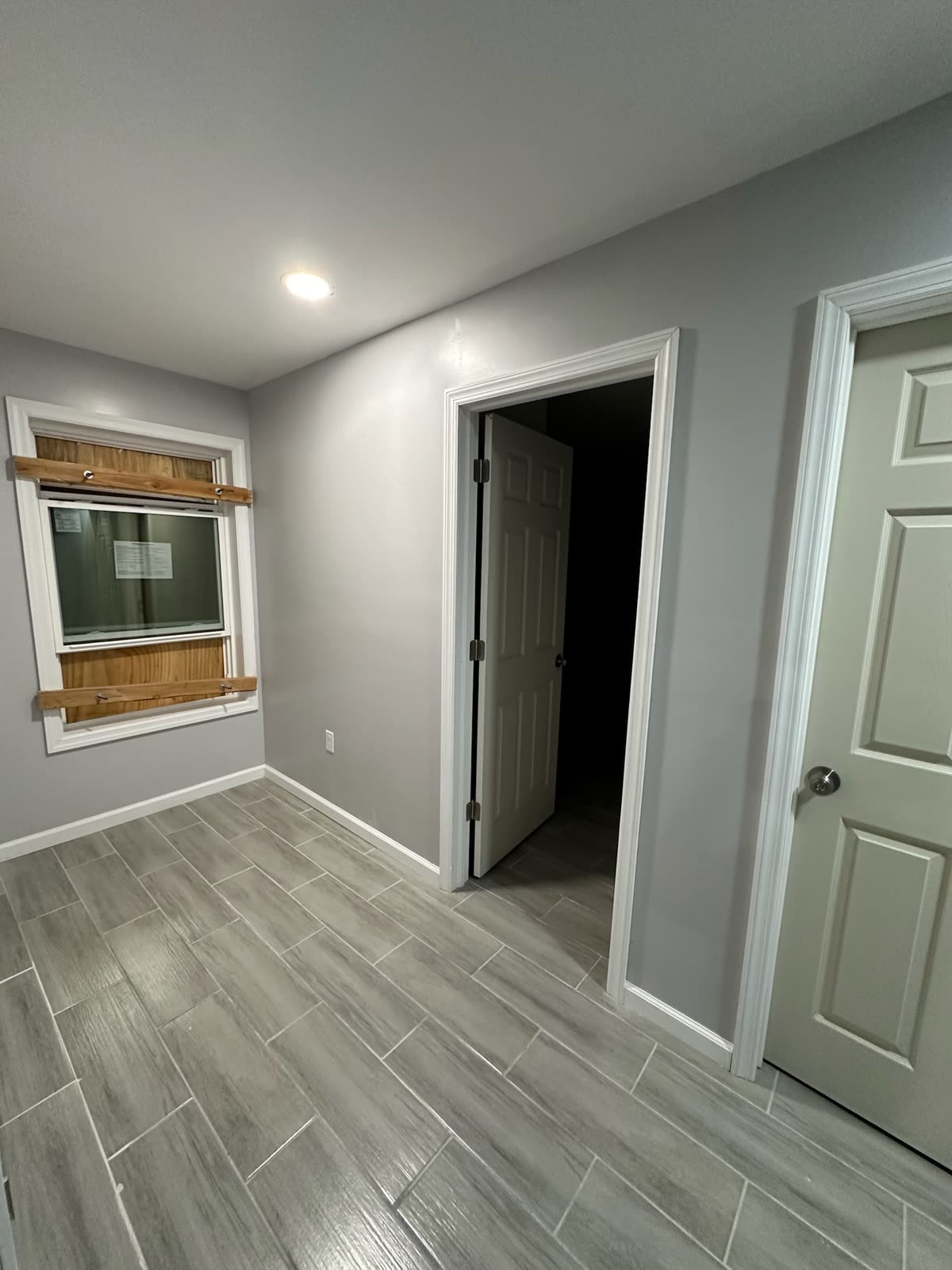 Two-bedroom basement apartment — real ARCED project photo 12 of 19
