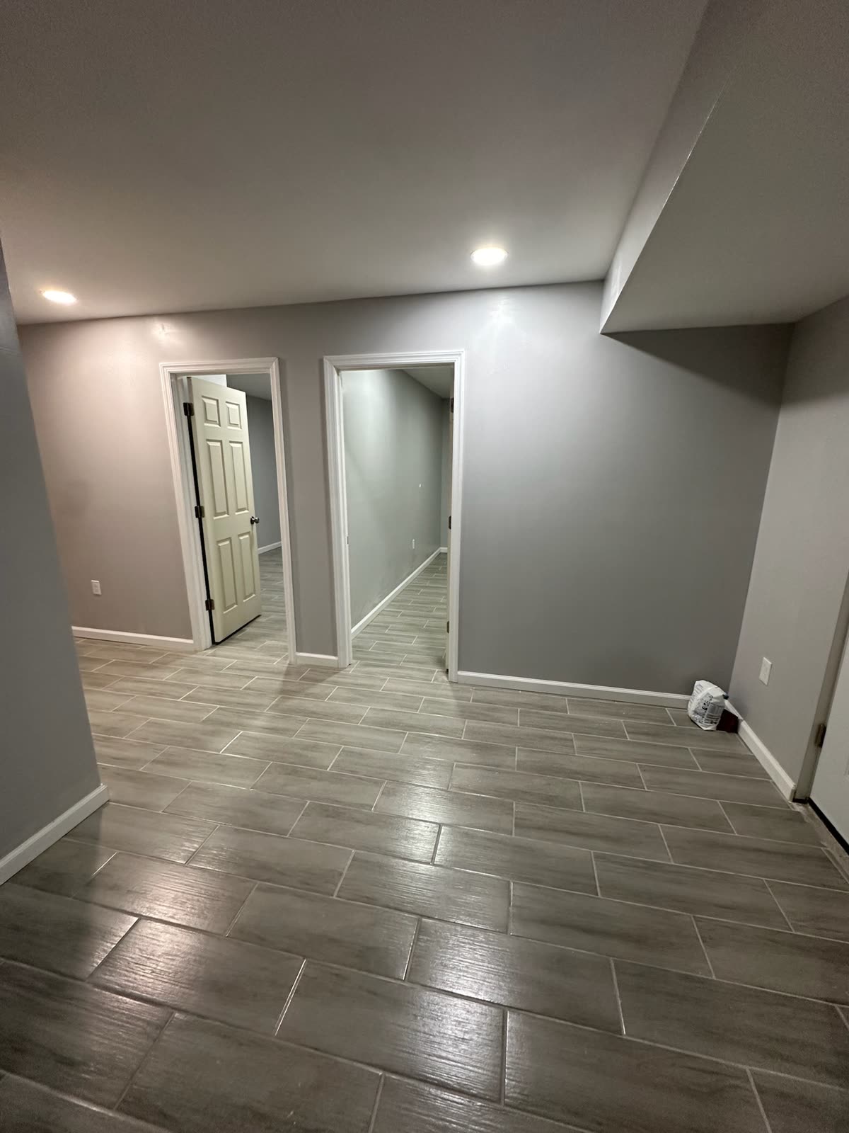 Two-bedroom basement apartment — real ARCED project photo 13 of 19