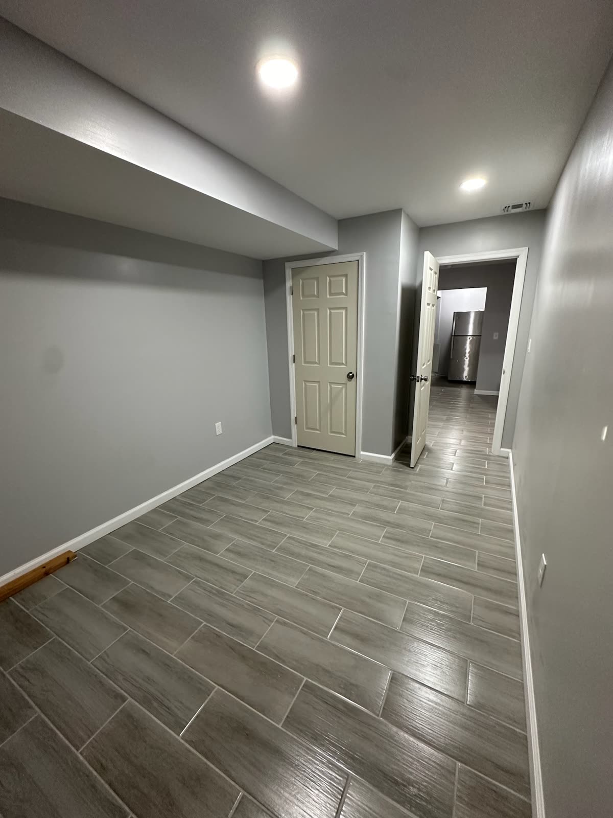 Two-bedroom basement apartment — real ARCED project photo 15 of 19