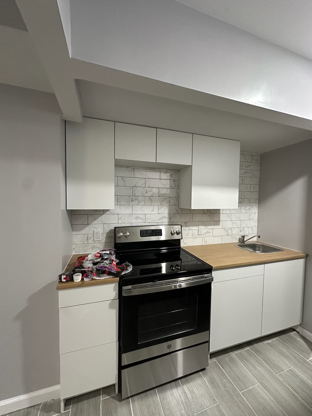 Two-bedroom basement apartment — real ARCED project photo 16 of 19