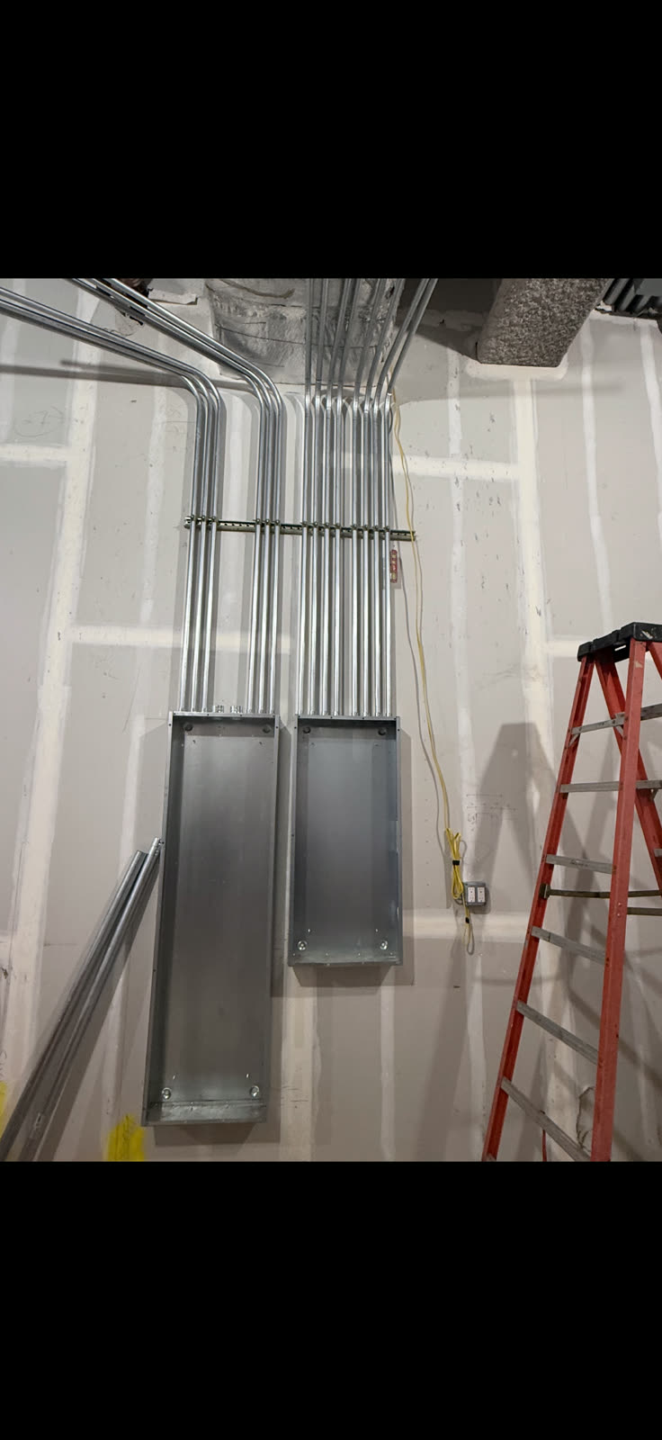 Organized electrical conduit runs installed on an ARCED project