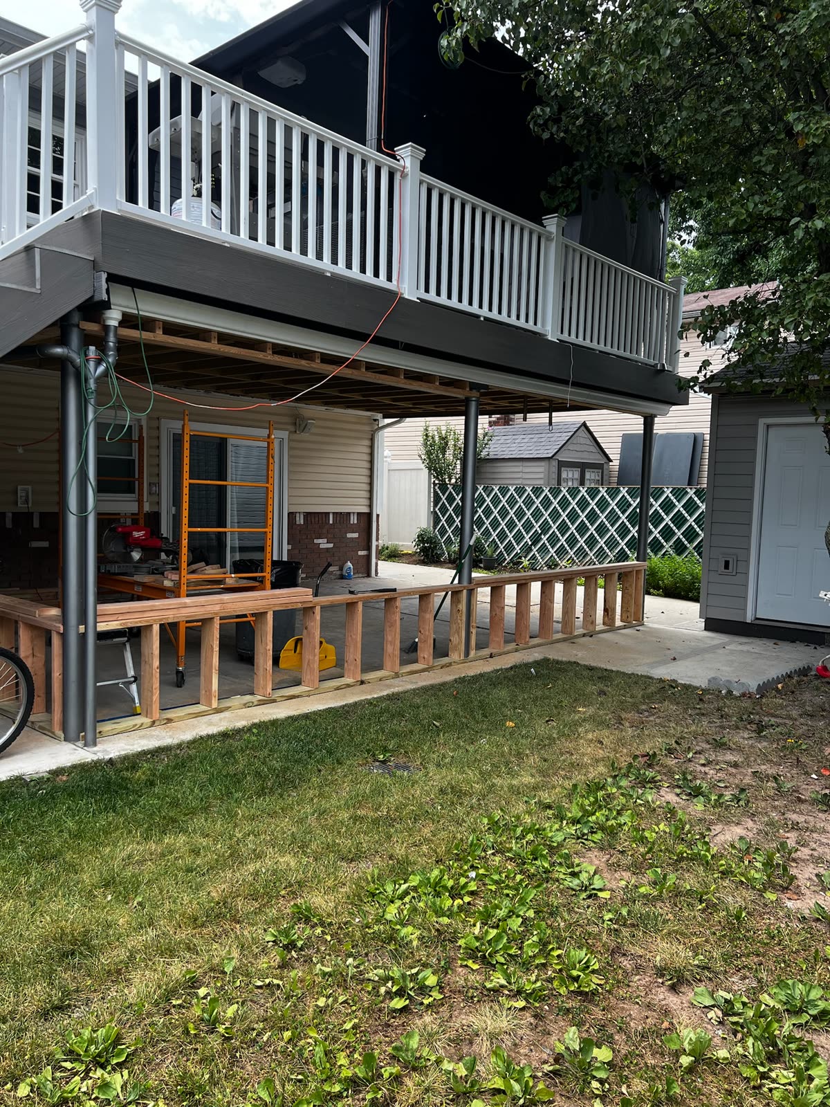 Exterior deck framing and railing work completed by ARCED
