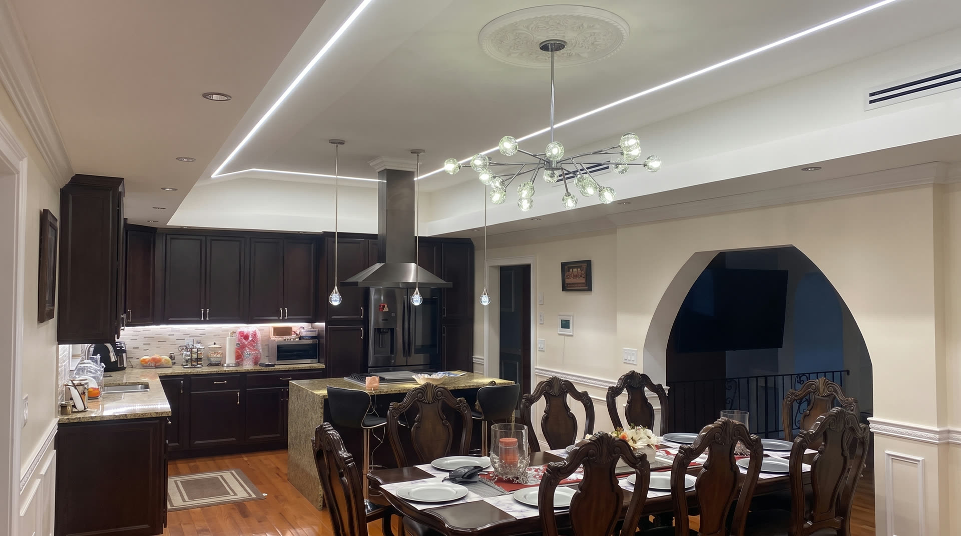 Completed ARCED kitchen and dining renovation with cabinetry, island and integrated lighting